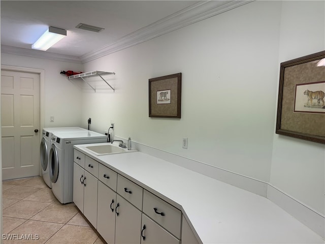 clothes washing area with light tile patterned flooring, separate washer and dryer, crown molding, cabinets, and sink