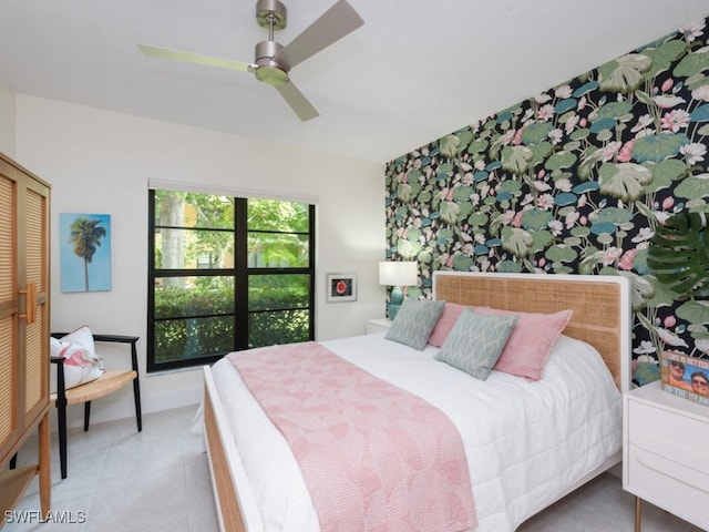 bedroom with tile patterned floors, ceiling fan, and a closet