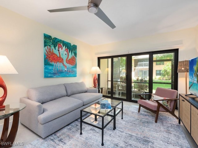 living room with ceiling fan and french doors