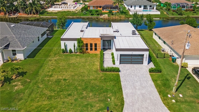 birds eye view of property with a water view