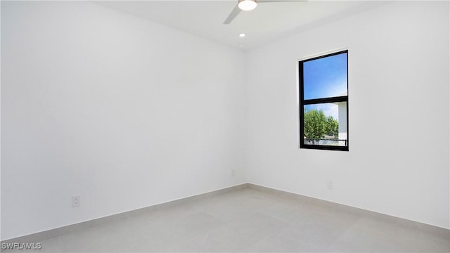 unfurnished room with ceiling fan