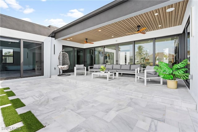 view of patio / terrace featuring ceiling fan and an outdoor living space