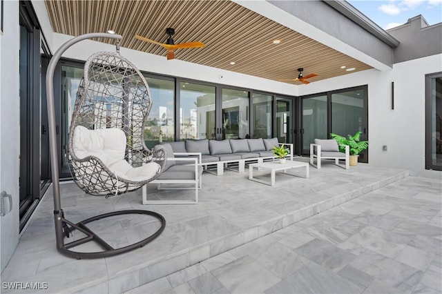 view of patio featuring an outdoor living space and ceiling fan