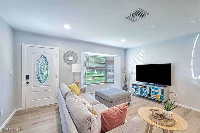 living room with light hardwood / wood-style floors