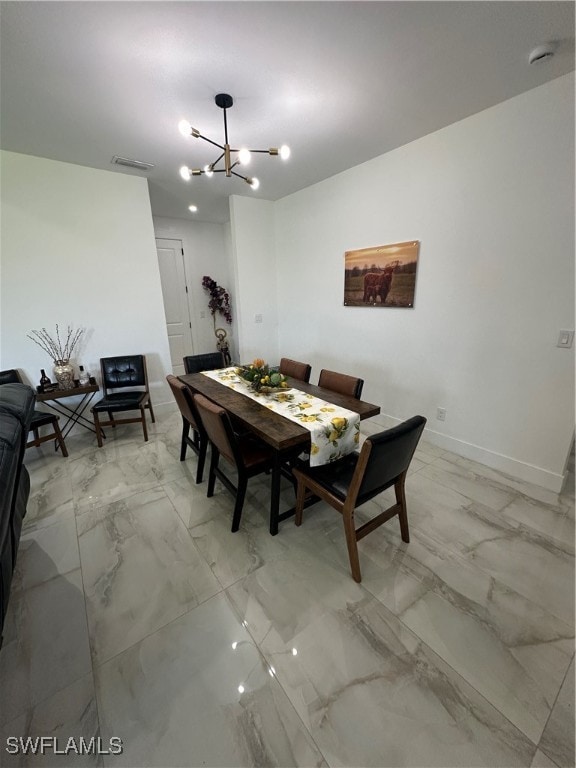 dining room featuring a notable chandelier