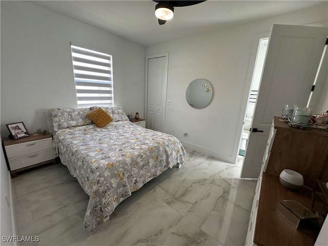 bedroom featuring ceiling fan and a closet