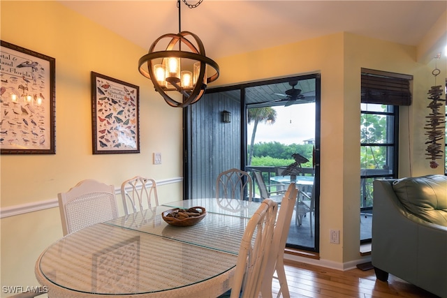 dining room with a notable chandelier and hardwood / wood-style floors