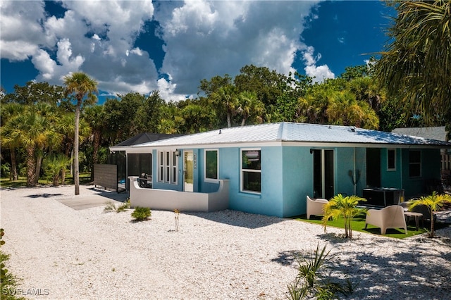 rear view of house with a patio