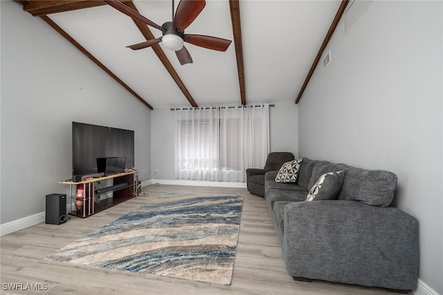 living room with vaulted ceiling with beams, hardwood / wood-style floors, and ceiling fan