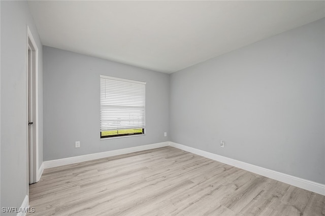 unfurnished room featuring light wood-type flooring