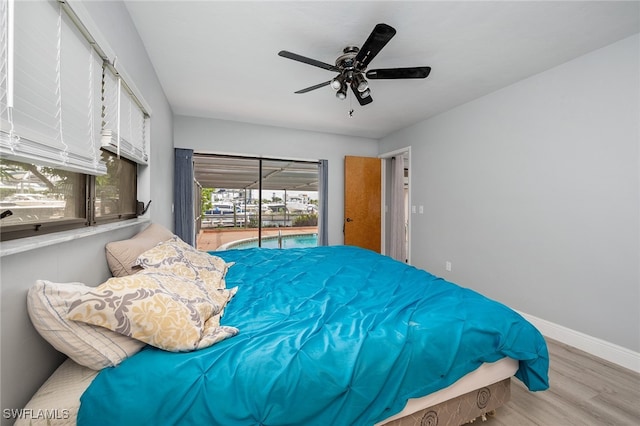 bedroom featuring access to outside, ceiling fan, and light hardwood / wood-style flooring