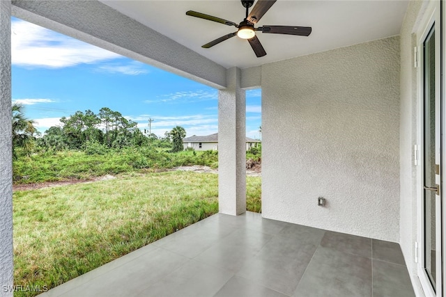 view of patio featuring ceiling fan