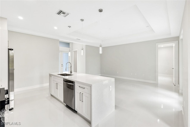 kitchen with stainless steel appliances, a tray ceiling, sink, white cabinets, and hanging light fixtures