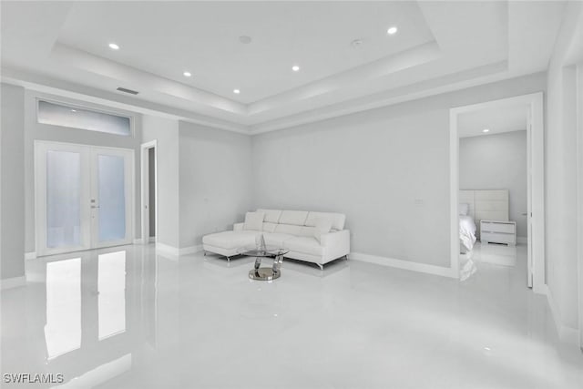 unfurnished room with recessed lighting, baseboards, visible vents, and a raised ceiling