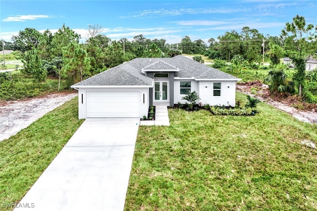 view of front of home featuring french doors, a garage, and a front lawn