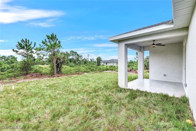 1155 Ermine St E, Lehigh Acres, FL 33974 - view of grassy yard with a ceiling fan and a patio