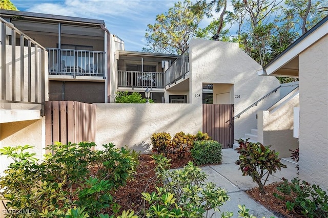 15330 Cedarwood Ln Unit 5-203, Naples, FL 34110 - view of front of property with stucco siding