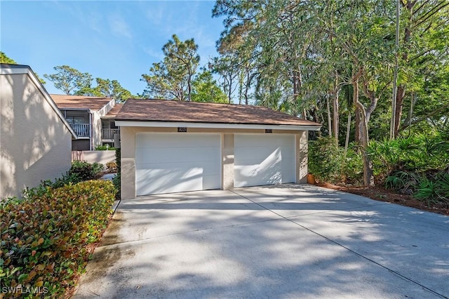 15330 Cedarwood Ln Unit 5-203, Naples, FL 34110 - garage with driveway