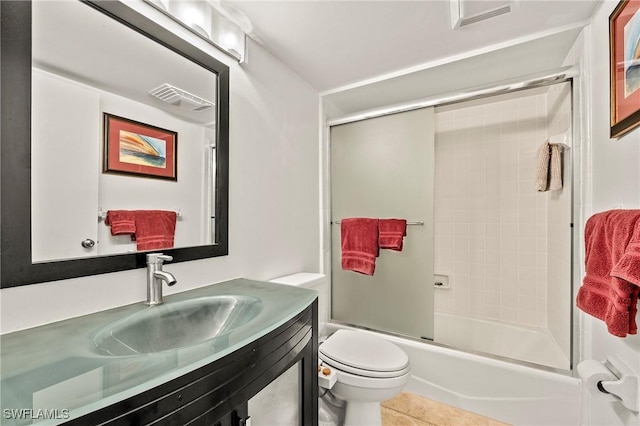 15330 Cedarwood Ln Unit 5-203, Naples, FL 34110 - full bathroom with toilet, vanity, combined bath / shower with glass door, and tile patterned flooring
