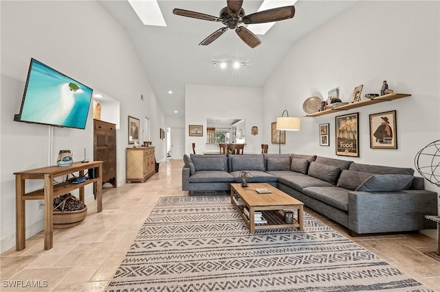 living room featuring high vaulted ceiling and ceiling fan