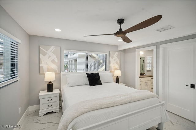 bedroom featuring ceiling fan and ensuite bathroom