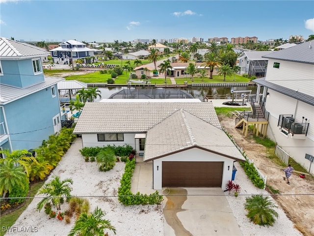 drone / aerial view featuring a water view