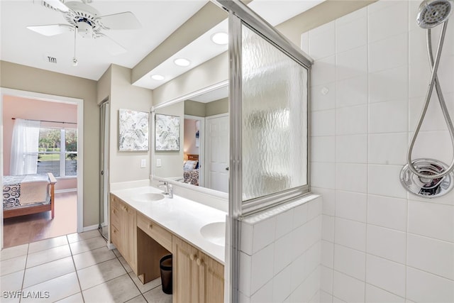 bathroom featuring ceiling fan, vanity, a shower with door, and hardwood / wood-style flooring