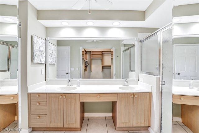 bathroom featuring walk in shower, tile patterned flooring, vanity, and ceiling fan