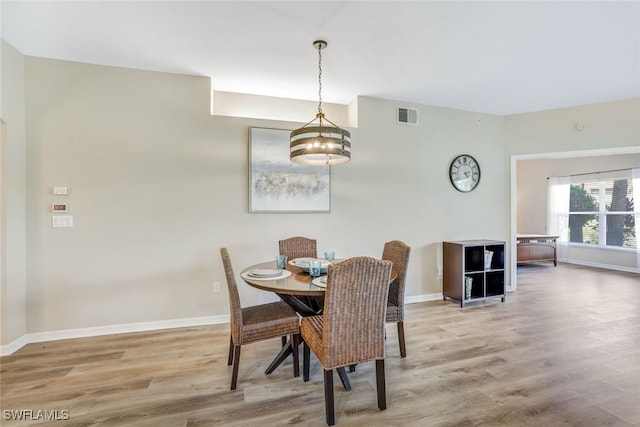 dining room featuring wood-type flooring