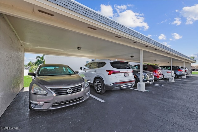 view of vehicle parking with a carport