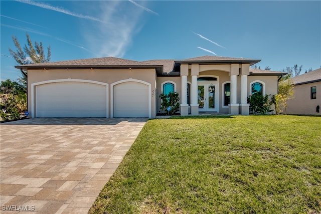 view of front facade featuring a front lawn and a garage