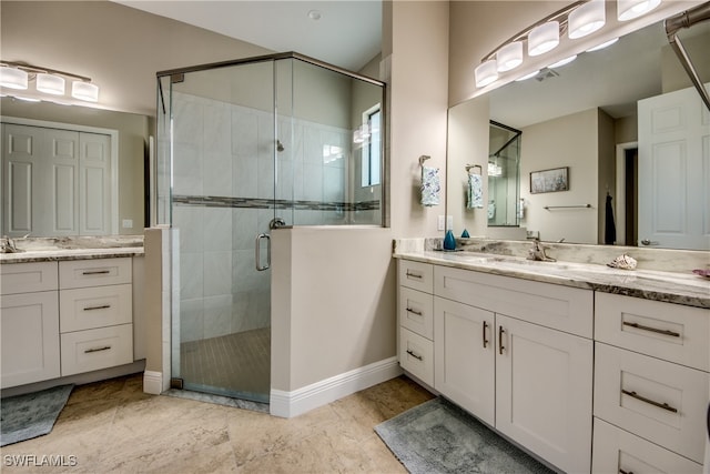 bathroom featuring an enclosed shower and vanity