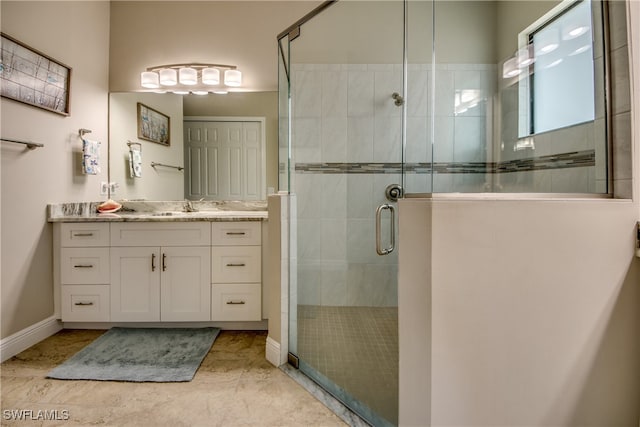 bathroom featuring walk in shower, vanity, and tile patterned floors