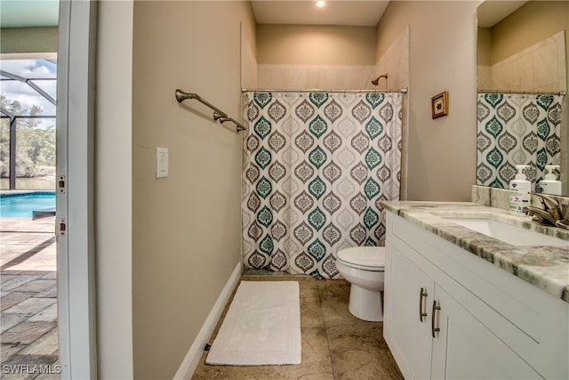 bathroom featuring walk in shower, vanity, and toilet