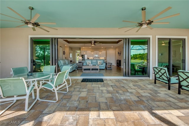 view of patio featuring ceiling fan