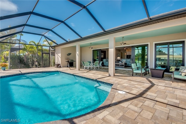 view of pool featuring a patio, area for grilling, a lanai, and ceiling fan