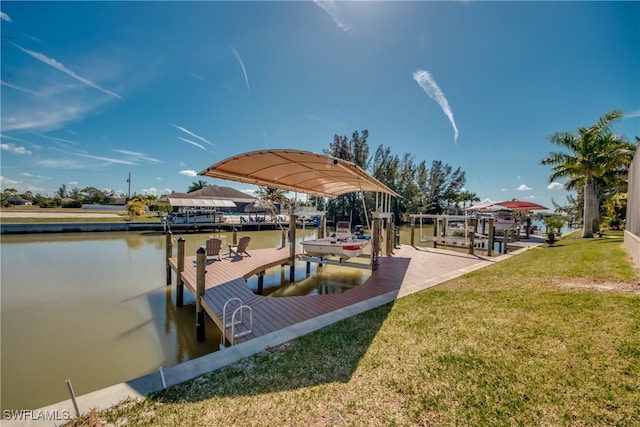 view of dock featuring a yard and a water view