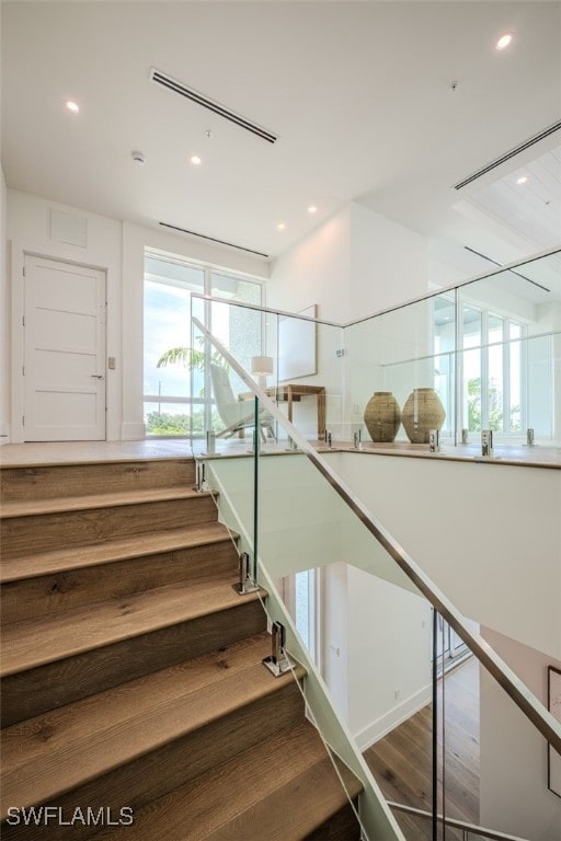 stairway with wood-type flooring