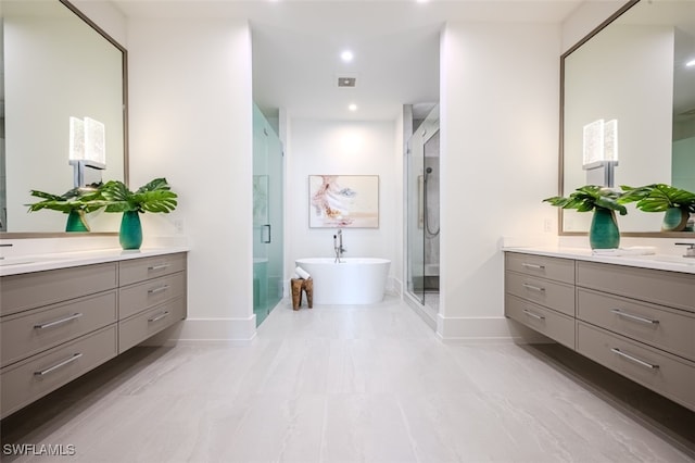 bathroom with independent shower and bath and vanity