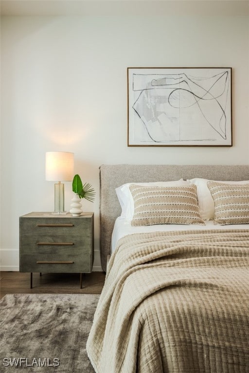 bedroom featuring dark wood-type flooring