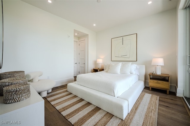 bedroom featuring dark hardwood / wood-style flooring