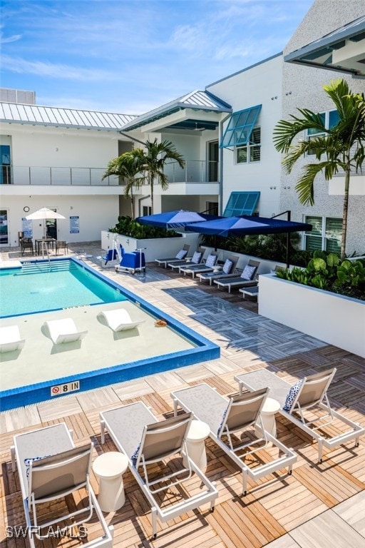 view of swimming pool with a patio area