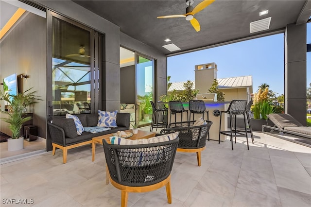 view of patio / terrace with an outdoor living space and ceiling fan