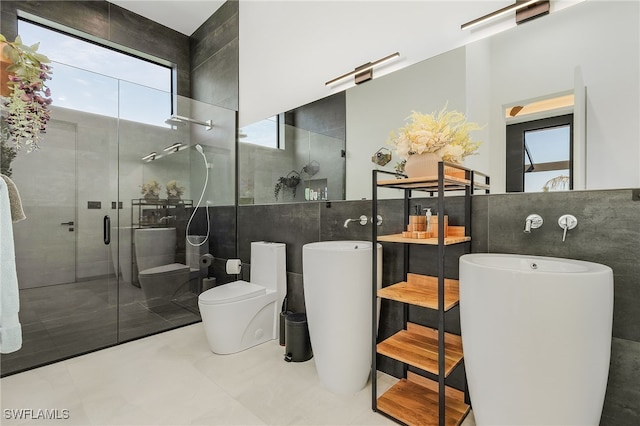 bathroom featuring tile walls, an enclosed shower, tile patterned floors, and toilet