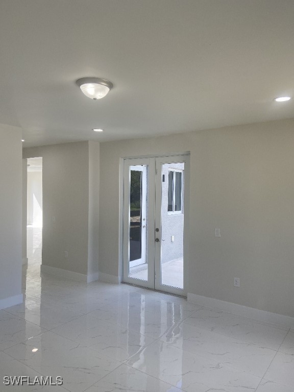 empty room featuring french doors