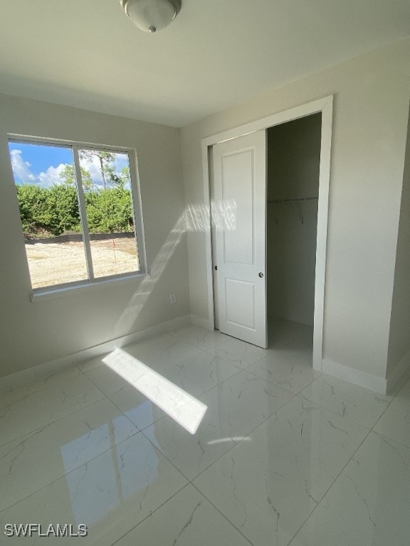 unfurnished bedroom featuring a closet