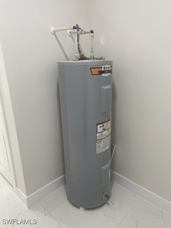 utility room featuring electric water heater