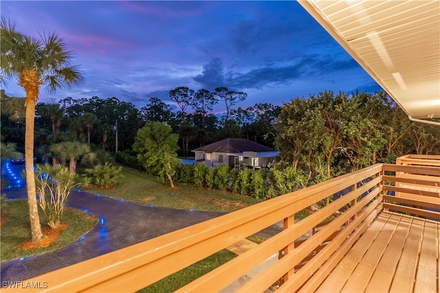 view of balcony at dusk