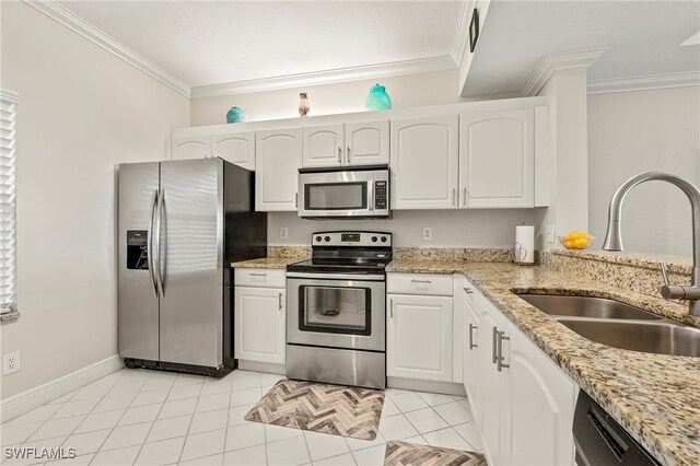 kitchen featuring stainless steel appliances, crown molding, sink, and white cabinetry