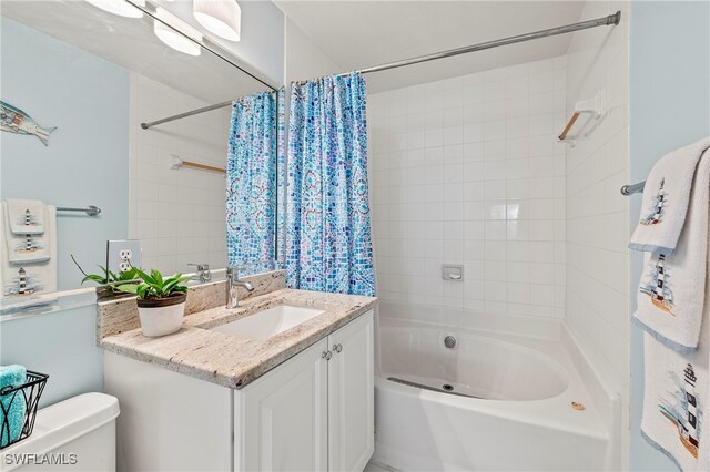 full bathroom featuring vanity, toilet, and shower / bath combo